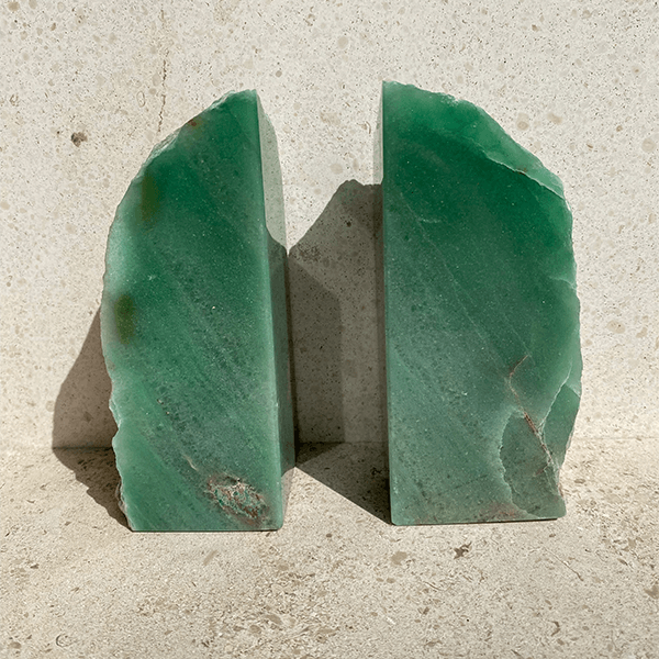 Aventurine green bookends, styled on natural stone