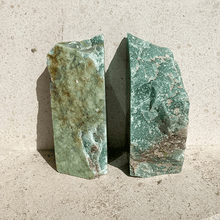 Load image into Gallery viewer, Aventurine green bookends, styled on natural stone
