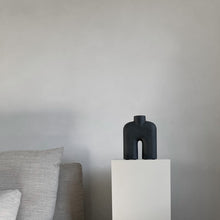 Load image into Gallery viewer, Tall black two-legged ceramic vase for holding flowers
