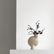 Load image into Gallery viewer, Asymmetrical sand coloured ceramic vase with flowers
